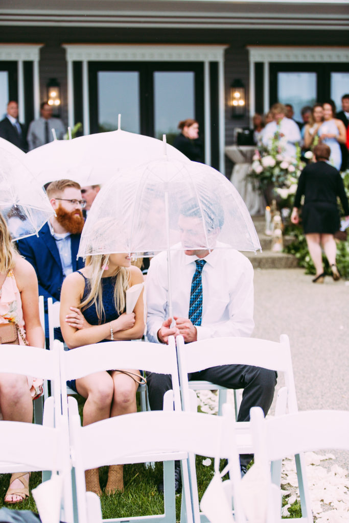 Umbrellas for rainy wedding day outdoor wedding