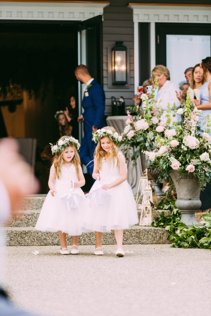 flower girls at outdoor wedding with flower crown